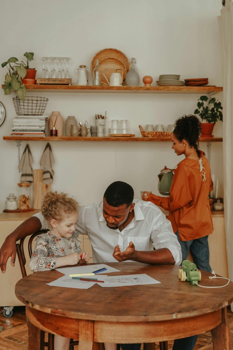 Father and daughter spending quality time doing homework at home.childcare development center